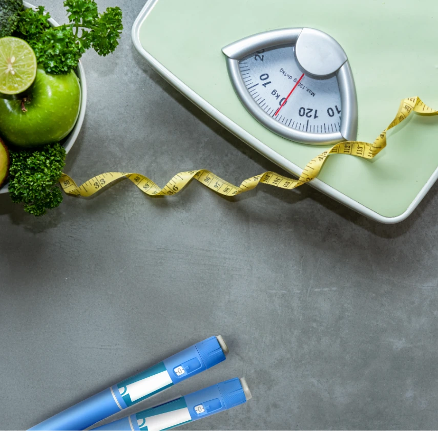 Scale, measuring tape, healthy foods, and injection pens